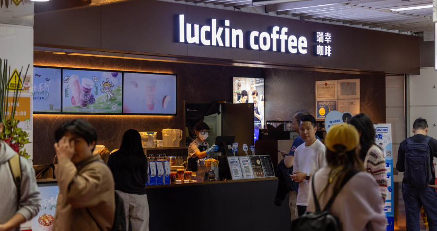 Customers ordering at a Luckin Coffee store in China, illustrating the rise of fast, app-based domestic coffee chains.