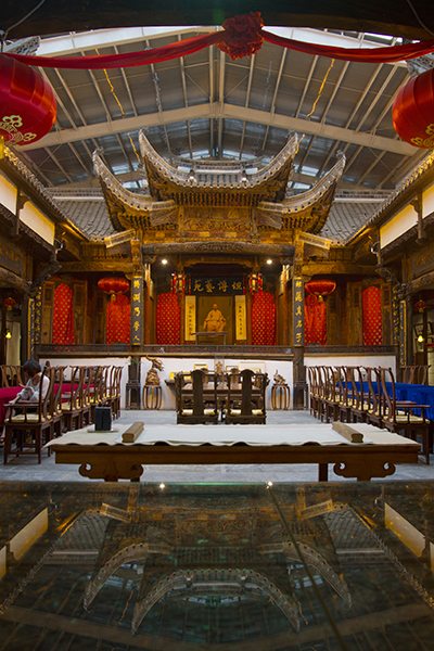 The courtyard of a Huizhou-style mansion preserved inside a glass house