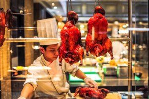Photo of Beijing duck being prepared in a restaurant