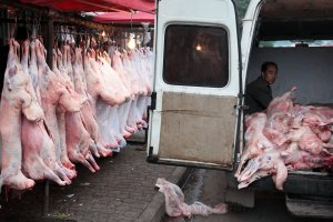 Slaughtered pigs in a Chinese meat market, where some pork is still available despite African swine fever.